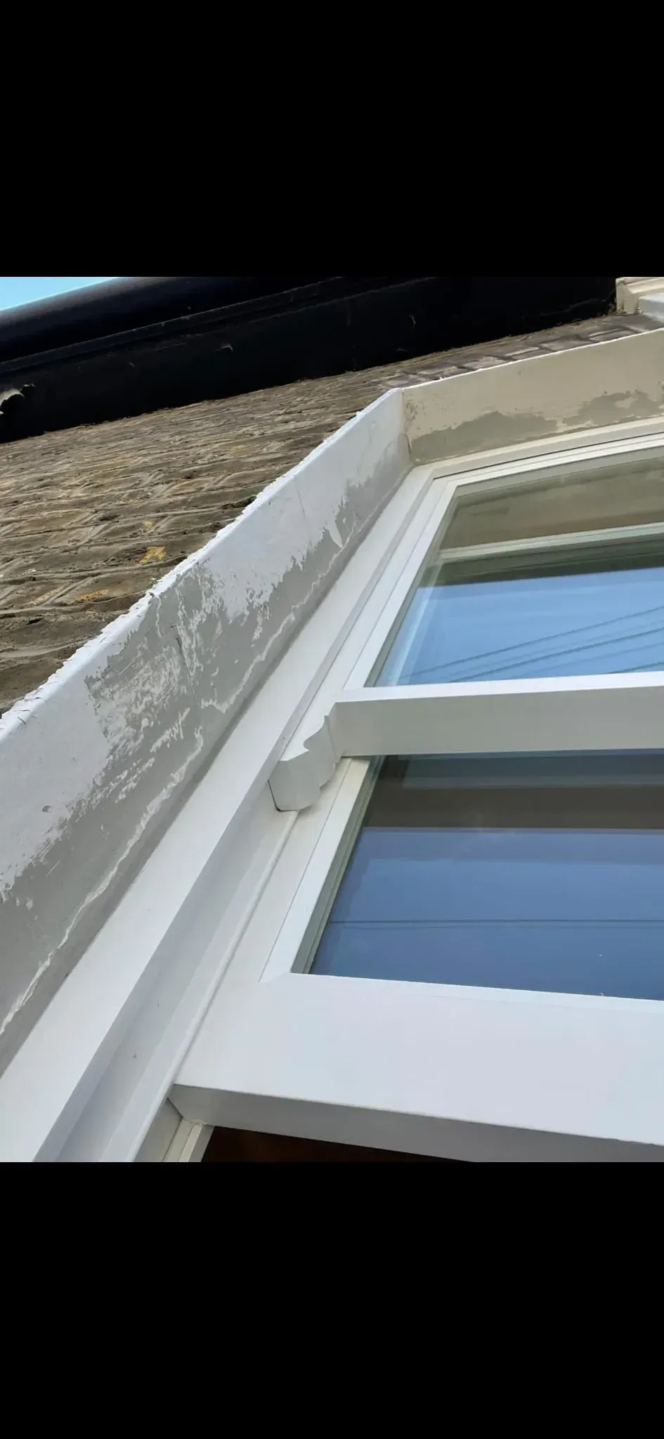 Victorian timber sash window with decorative sash horn installed in a period brick reveal